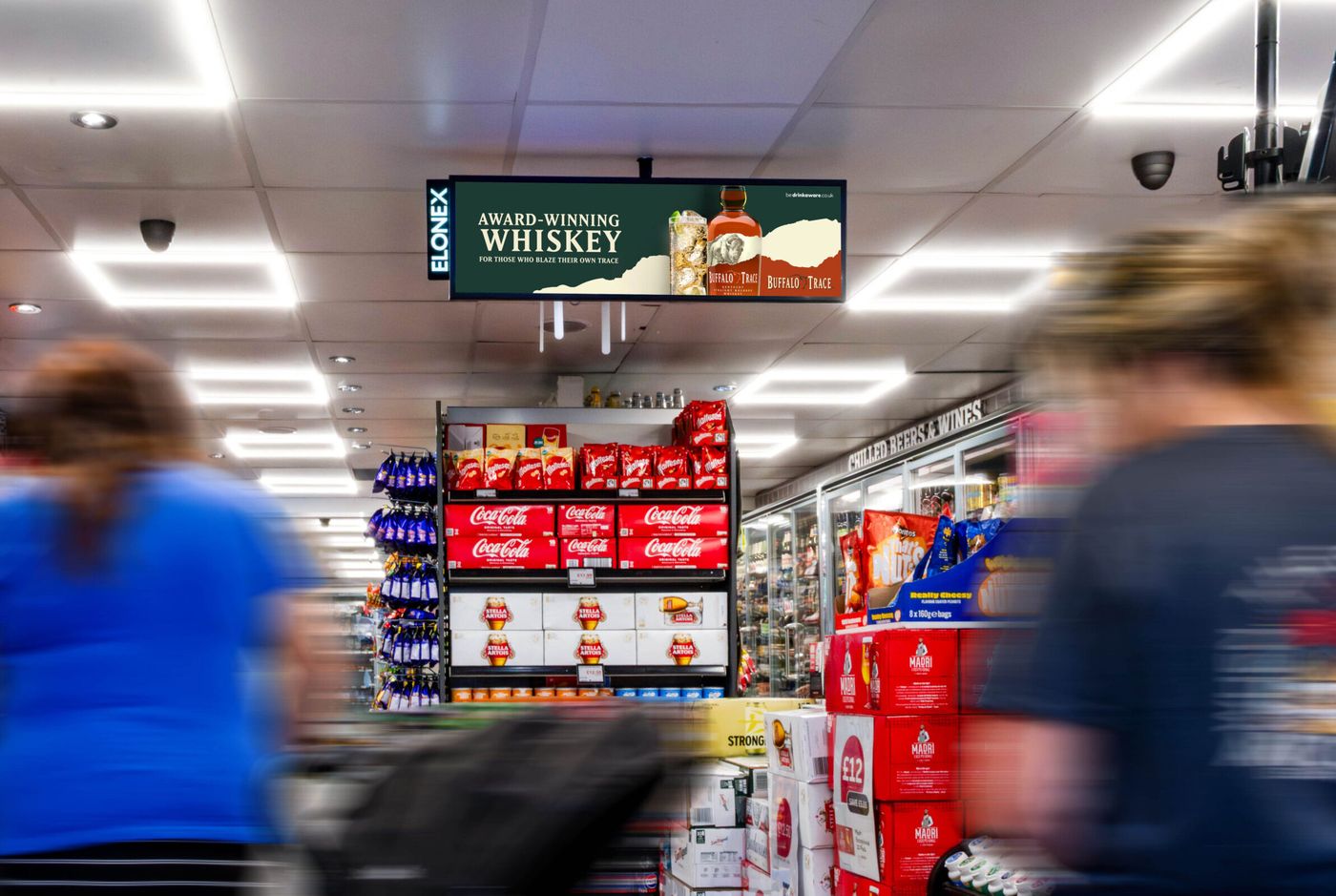 Digital screens above the aisles in a convenience store